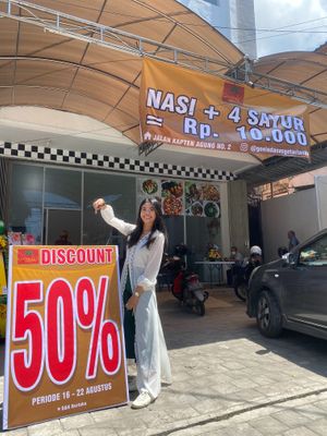 Spacious parking lot at Govinda's Vegetarian Restaurant in Denpasar