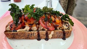 Smash white beans, tomato, balsamic and crispy Kale🤤 at Pink Neon Sign in Auckland