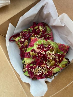 Beetroot hummus & avocado toast at Pink Neon Sign in Auckland