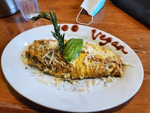 Vegan omlette with vegan beef, vegan cheese, onions, salsa and Avocado.  at Chops & Eggs in Corpus Christi