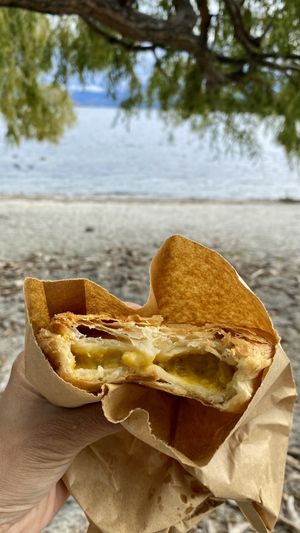 Enjoying the vegan curry pie at the lakefront   at The Doughbin Bakery in Wanaka