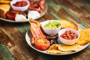 Vegan Big Breakfast. Vegan Bacon rashers, Vegan eggs, mushrooms, roasted tomato, hash brown, beans and avocado at Claudia Road Cafe in Toongabbie