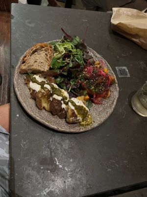 Chose the veggie plate.  Comes with two sides. Smashed potatoes with chimichurri. And tomato/peach salad.  Out of tofu or I would have added that.  at Honest Greens - Born in Barcelona