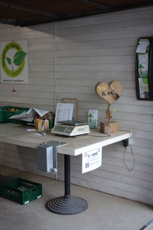 The "checkout" corner with a price list, a scale, and a money box at Möhre ohne Mist in Kandel