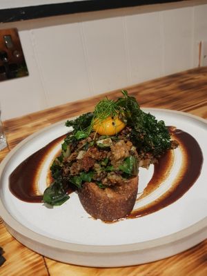 Highlander toast with runny "egg" yolk.  at Green Routes Cafe in Oxford