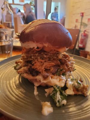 Photo of the Big Festdev - "roast pork" with slaw, apple sauce, mayo, sage&onion stuffing in a pretzel bun. at Green Routes Cafe in Oxford