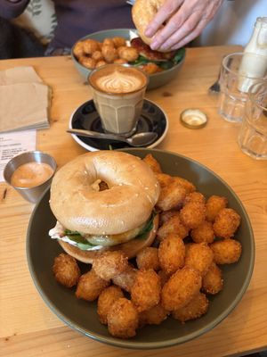 Bagel baby and latte  at Green Routes Cafe in Oxford
