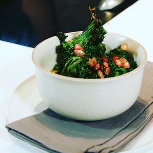 Polenta made with fresh corn, kale, smoked almonds and pomegranate.  at VHY! in Stuttgart