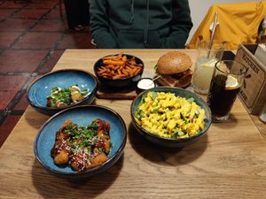 Cauliflower salad, no chicken burger, sweet potato fries, cauliflower bites, cheese bites at Tabi Loo in Leuven