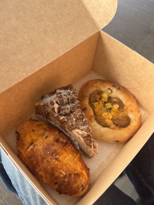 Pizza salt bread, apple crumble cake and Sausage and cheese bun 🤤 #Veganuary at Level V Bakery in Vancouver