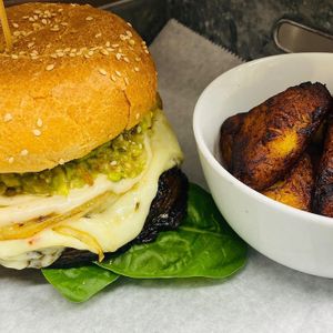 Pesto marinated Portobella burger, avocado, organic spinach, cilantro aioli, sweet plantains,  at De Leon Latin Cocina in St Augustine