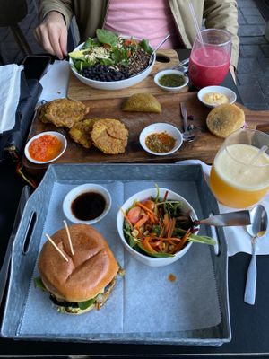 Pesto marinated Portobella burger, avocado, pepperjack , organic spinach, cilantro aioli, sweet plantains, empanadas, tostónes (green plantains) #vegetarian #veggielove at De Leon Latin Cocina in St Augustine