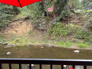 View of the creek from the outdoor dining areaa  at Beau Jo's in Evergreen