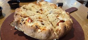 Vegan Vegan sausage and Vegan pepperoni "Mountain Pie" pizza with added calabrian chili peppers and pineapple. at Beau Jo's in Arvada