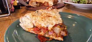 Vegan Vegan sausage and Vegan pepperoni "Mountain Pie" pizza with added calabrian chili peppers and pineapple. at Beau Jo's in Arvada