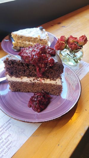 chocolate cake with cream filling and berrys, carrot cake at Veggie Beans and Shakes in Bogota
