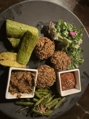 Mixed vegetables plate with falafel, tomato sauce, baba ganoush, zucchini, parsley and green beans.   at La Triskalla in Essaouira