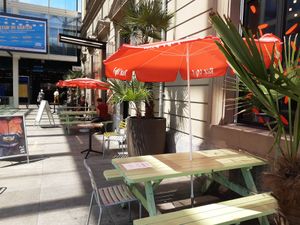 "Outdoor" seating under glass roof at Rice Up in Winterthur