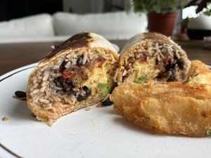  Breakfast burrito w/JUST Egg and yucca fries 😋   at Roasted and Raw in Oakland