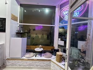 Cute little love seat setup in the window   at Be Mine Bar & Bistro in Helsinki