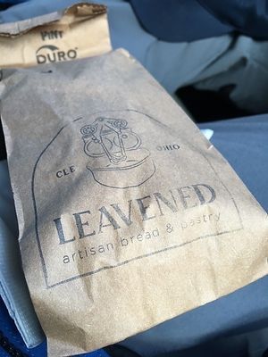 Sandwich packaged in paper bag at Leavened in Cleveland