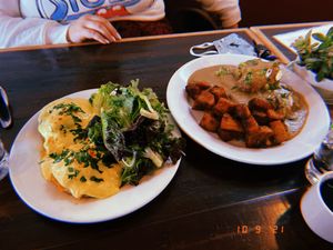 Carrot and lox Benedict and biscuits and gravy  at Allyum in Seattle