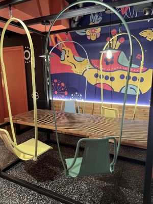 Tried these chairs and they were very cool, you can swing in all directions   at Flower Burger in London