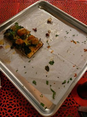 Also ate the Jackie Chan right away! Each square slice is sliced to provide 4 easy to pick up pieces. at Wildwood Pizza in Punta Gorda