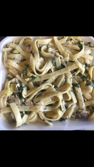 Fettuccine alfredo 😍 with spinach, mushrooms, garlic,  and artichoke hearts!! at Vegan Korner in Grand Terrace