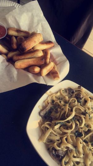 Breadsticks and fettuccine Alfredo!! 😍😍 at Vegan Korner in Grand Terrace