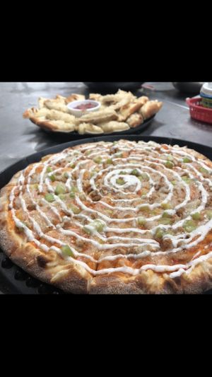 Buffalo chicken ranch pizza with cheesy bread at Vegan Korner in Grand Terrace