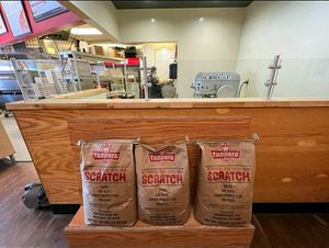 Watch them make the dough fresh every morning! at Toppers Pizza in Sioux Falls