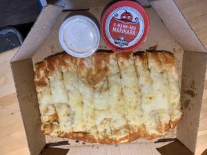 Single veganstix topperstix (vegan cheese sticks) with marinara and vegan ranch

 at Toppers Pizza in Sioux Falls