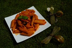 Penne all'Arrabbiata :

Penne cooked in a spicy red tomato sauce made with tomatoes, olive oil,minced garlic and red chilli flakes.
 at CraveLok in Pune