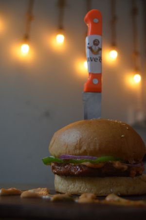 Crave-Patty burger :

Signature Cravelok burger with a chewy and juicy in-house seitan patty loaded with 1000 island dressing and plant-based cheese at CraveLok in Pune