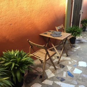 Sit out and eat whilst enjoy the sea view and breeze in our outdoor walled garden.  at Blessed And Gifted in Tower Isle