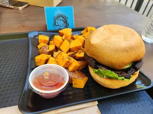 Portobello mushroom burger with sweet potato cubes at Copper Branch in Nashville
