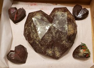 Breakable chocolate heart with strawberries and truffles for Valentines Day at GG's Vegan Bakery in Bozrah