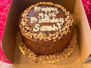 Chocolate cake w/ chocolate frosting, caramel, & peanuts.  at GG's Vegan Bakery in Bozrah