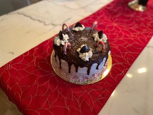 Peppermint chocolate cake, pepper mint vanilla frosting, chocolate peppermint drip, candy canes, & tree shaped “peppermint patties” at GG's Vegan Bakery in Bozrah