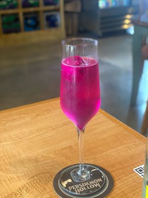 Our stunning Dragon Fruit Sorbet Mimosa! Tons of flavor options such as Mango Chili Lime, Watermelon Mint, and Limoncello to name a few. at Persimmon Hollow Brewing Co in Orlando