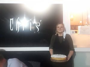 Chris with the custom made vegan lemon cake at Chris Kitchen in Fuerteventura
