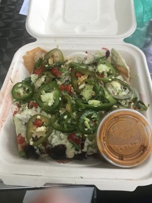 Loaded nachos with hibiscus Barbacoa  at The Local Coco in Atlanta