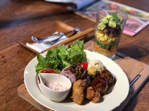 COTONOHA Buddha bowl with vegan meatballs and fried chicken. 
With glass art salad and soup at Cotonoha Kitakamakura  in Kamakura