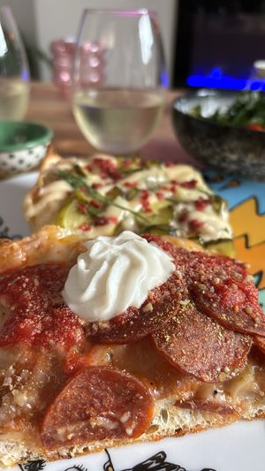 Pickle pizza and pepperoni vegan with ricotta   at Maipai in Hamilton