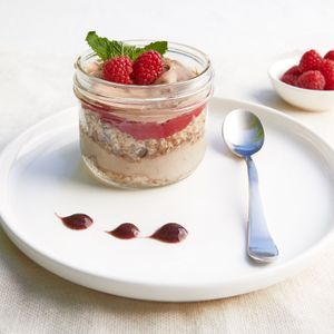 Lucuma Parfait - Delicate Lucuma flavor coupled with sweet and tart Raspberry coulis on a Sprouted Walnut Date crumble.  Decadent! at Sprightly in Vancouver