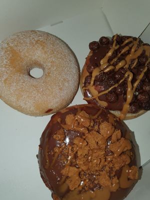 2 filled donuts and a sugar donut at Boogie Donuts in Munich