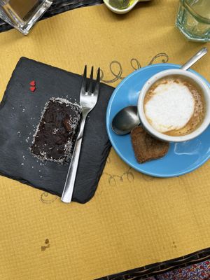 Vegan brownie and caffè macchiato with soy milk and vegan biscotto  at Vegamore in Milan