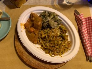 Lunch plate: noodles, greens and seitan stew €11  at Vegamore in Milan
