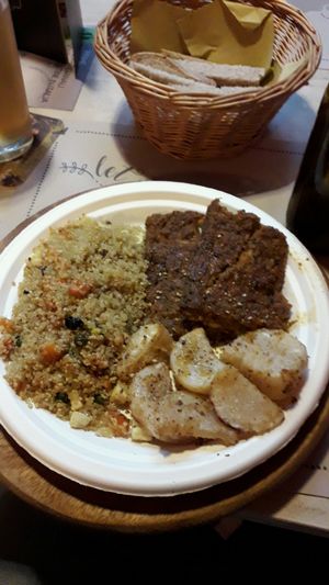 piatto con quinoa e tofu artigianale, daikon gratinato e medaglioni di cereali misti at Vegamore in Milan